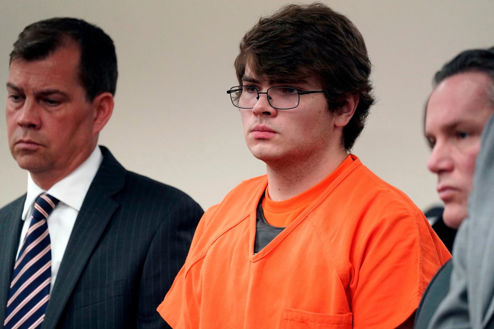 Photo: On this February 15, 2023, file photo, Payton Gendron, center, listening while sentenced to life imprisonment without probation, in a room of the Erie County Court, in Buffalo, New York