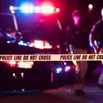 Photo: Police officers and crime scene in a file photo without date.